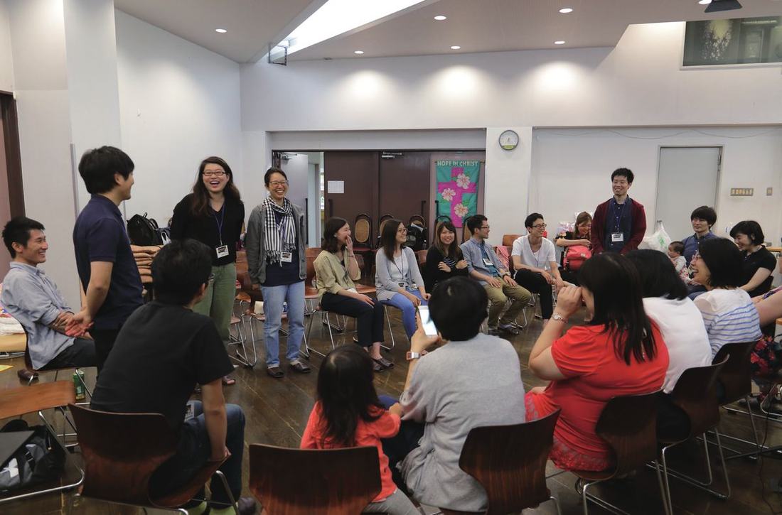 A JCFN regional gathering meeting in a plain multipurpose room